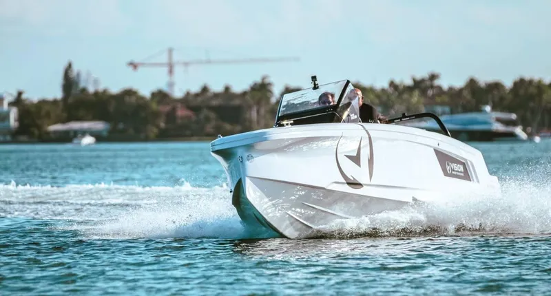 Slide: The Image of 2021 Axopar Spyder 22 speeding on water with scenic background. - 4