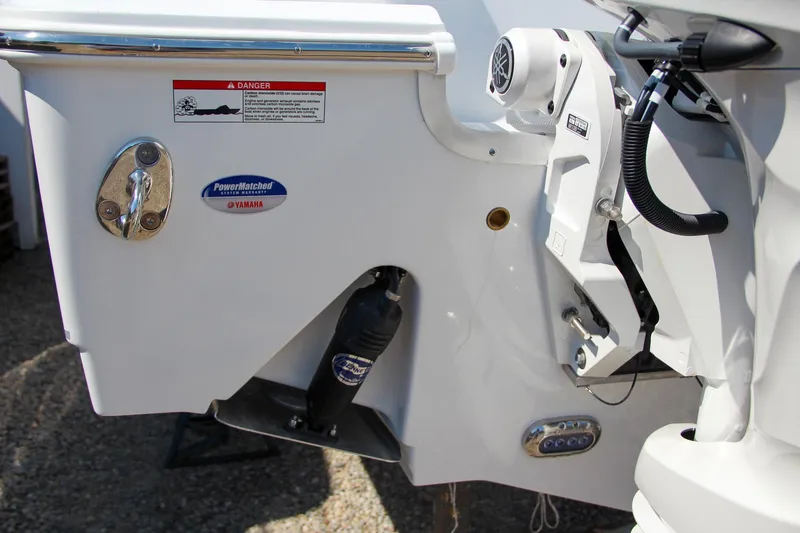 Slide: The Image of 2025 Sea Hunt Gamefish 25 boat transom with Yamaha components and warning label. - 13