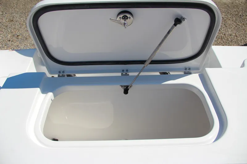 Slide: The Image of 2025 Sea Hunt Gamefish 25 open storage compartment on deck. - 18