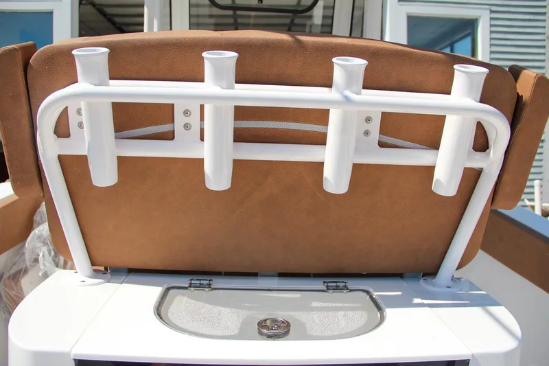 Slide: The Image of 2025 Sea Hunt Gamefish 25 boat seat with rod holders and storage compartment. - 21