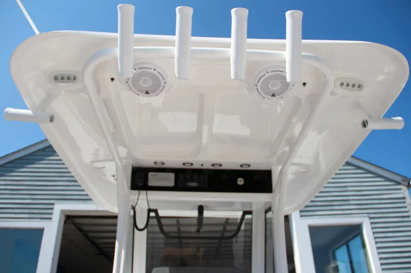 Slide: The Image of 2025 Sea Hunt Gamefish 25 boat T-top with rod holders and speakers. - 22