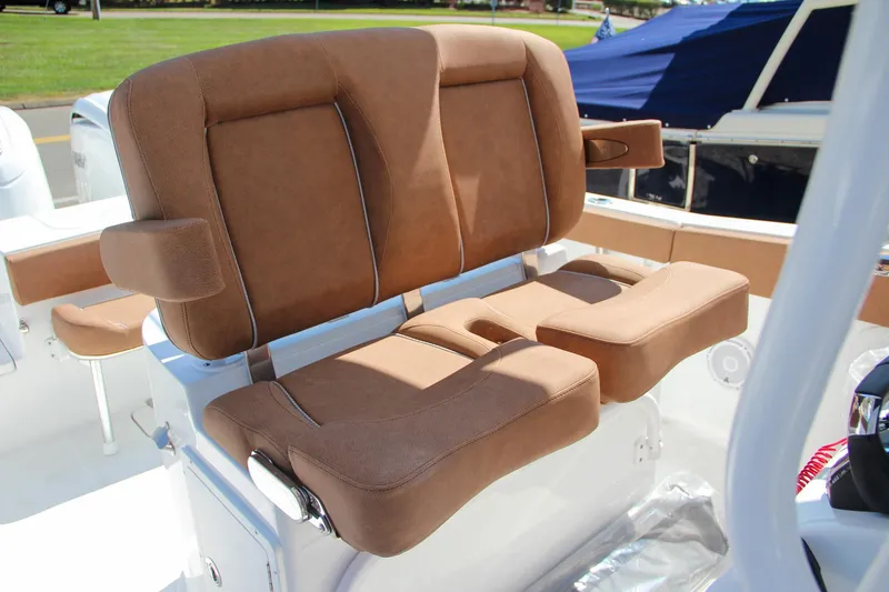 Slide: The Image of 2025 Sea Hunt Gamefish 25 boat seating with brown cushions. - 26