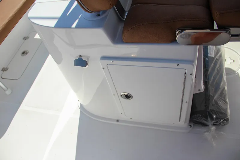 Slide: The Image of 2025 Sea Hunt Gamefish 25 boat interior with storage compartment and seating. - 27