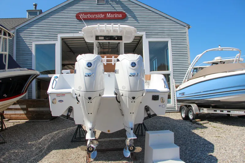Slide: The Image of 2025 Sea Hunt Gamefish 25 at Harborside Marina, featuring dual engines. - 3