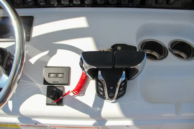 Slide: The Image of Sea Hunt Gamefish 25 boat controls, 2025 model, featuring modern dashboard and throttle. - 33