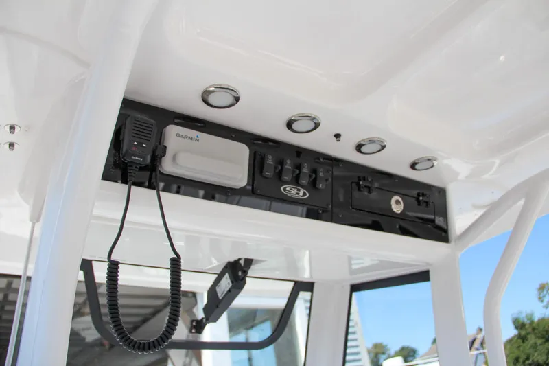 Slide: The Image of 2025 Sea Hunt Gamefish 25 console with electronics and controls. - 36