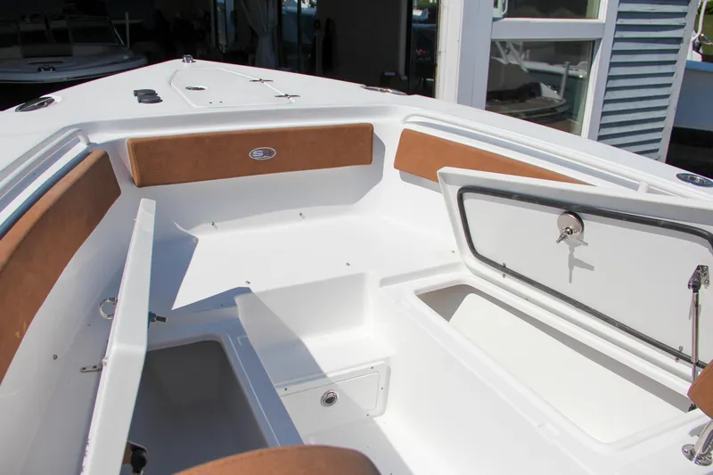 Slide: The Image of 2025 Sea Hunt Gamefish 25 boat interior with open storage compartments. - 41