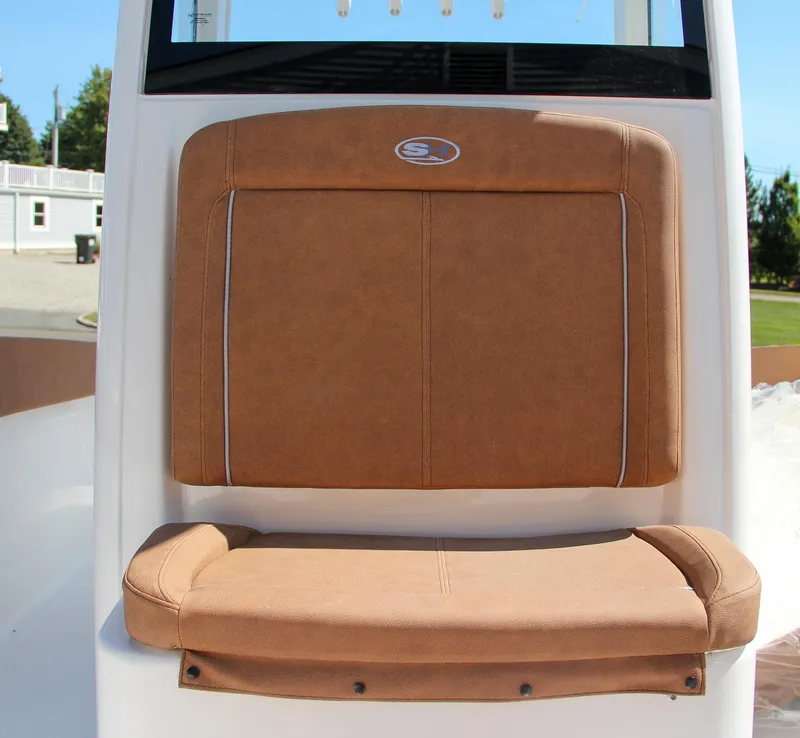 Slide: The Image of 2025 Sea Hunt Gamefish 25 boat seat with tan upholstery and logo. - 42