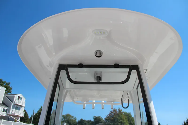 Slide: The Image of 2025 Sea Hunt Gamefish 25 boat canopy against clear blue sky. - 43