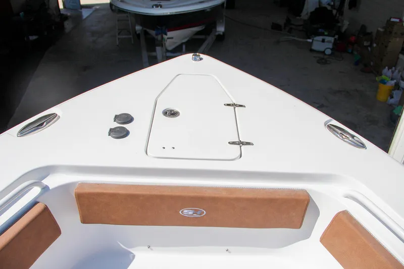 Slide: The Image of Bow of 2025 Sea Hunt Gamefish 25 boat with storage hatch and seating. - 44