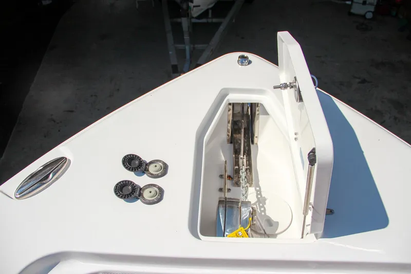 Slide: The Image of Anchor compartment of 2025 Sea Hunt Gamefish 25 boat, open hatch view. - 48