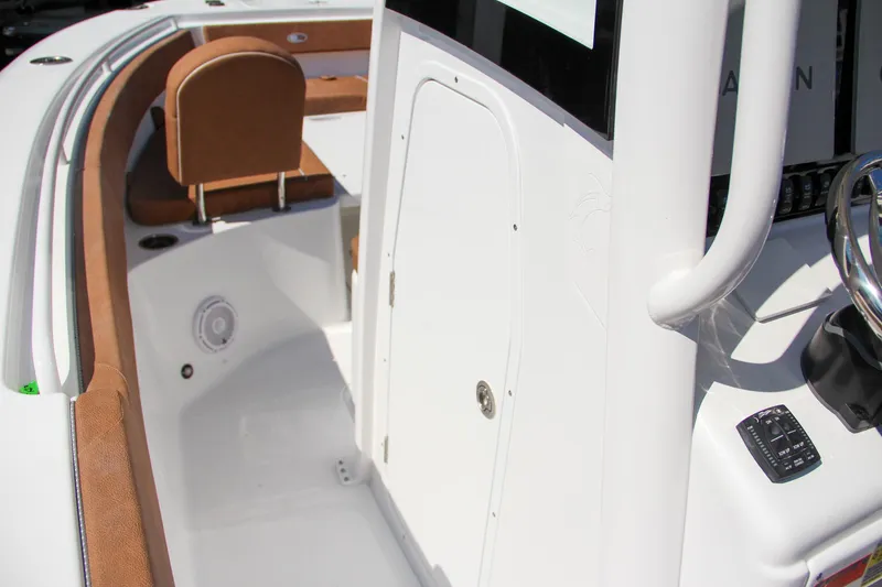 Slide: The Image of 2025 Sea Hunt Gamefish 25 boat interior with seating and storage compartment. - 49