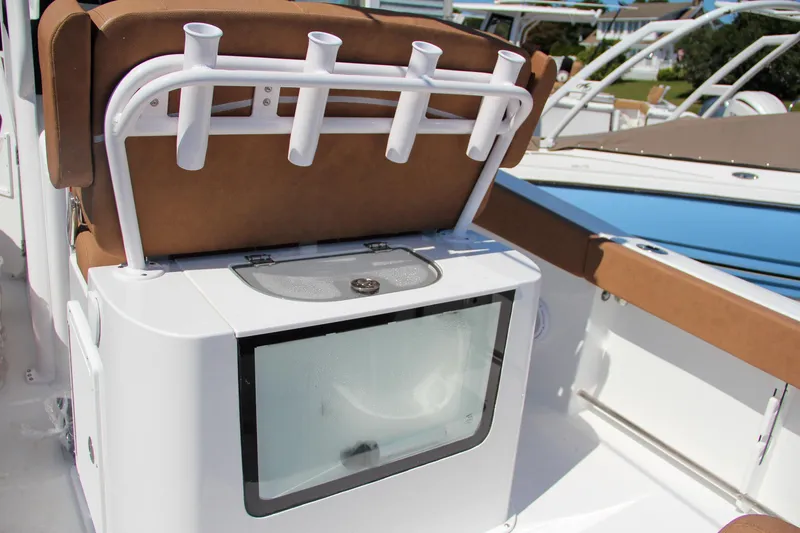 Slide: The Image of 2025 Sea Hunt Gamefish 25 boat with rod holders and storage compartment. - 6
