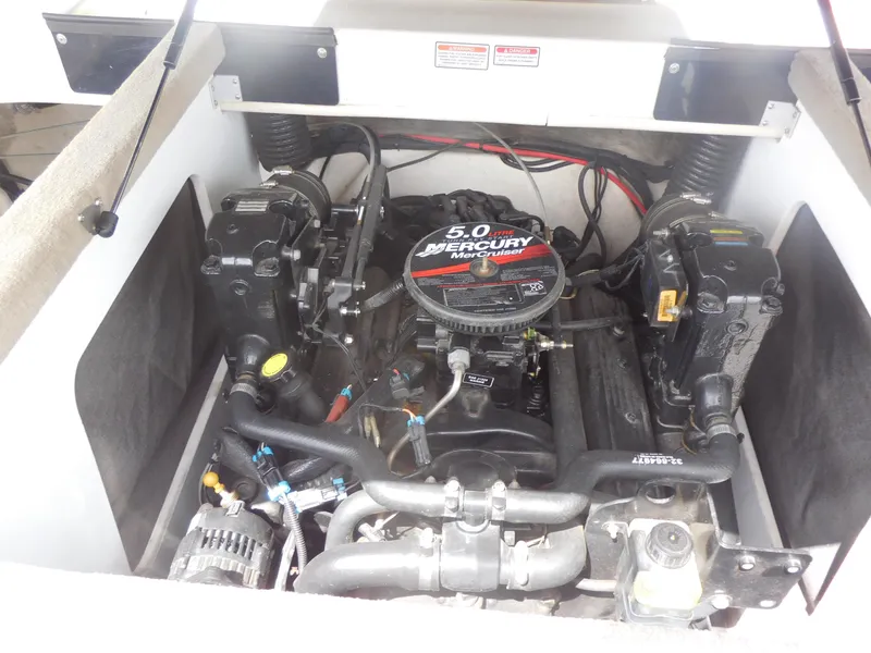 Slide: The Image of Engine compartment of a 2006 Sea Ray 205 Sport boat with Mercury 5.0 motor. - 12