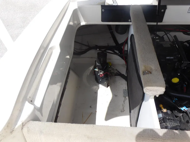 Slide: The Image of 2006 Sea Ray 205 Sport engine compartment with visible wiring and components. - 13