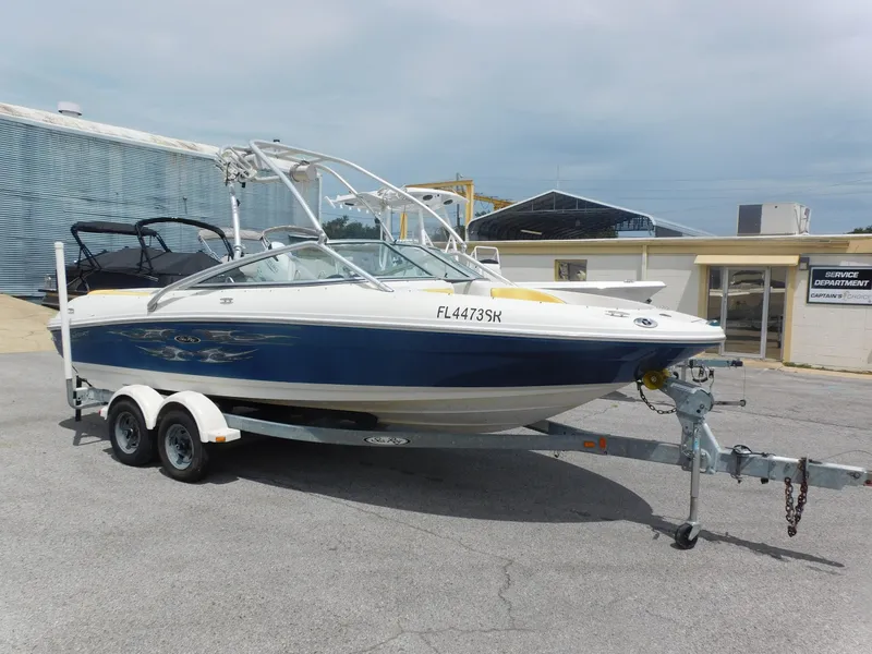 Slide: The Image of 2006 Sea Ray 205 Sport boat on trailer, parked outdoors. - 19