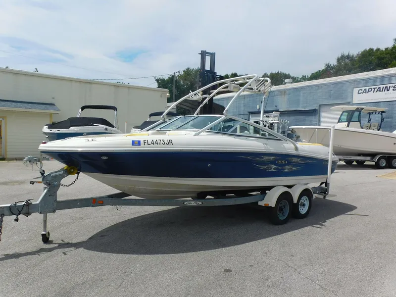 Slide: The Image of 2006 Sea Ray 205 Sport boat on trailer in marina parking lot. - 20