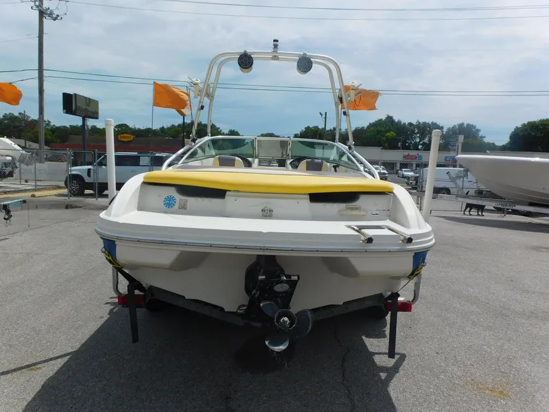 Slide: The Image of 2006 Sea Ray 205 Sport boat, rear view, parked on pavement. - 21