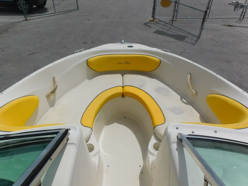 Slide: The Image of 2006 Sea Ray 205 Sport boat with yellow seating in the bow area. - 4