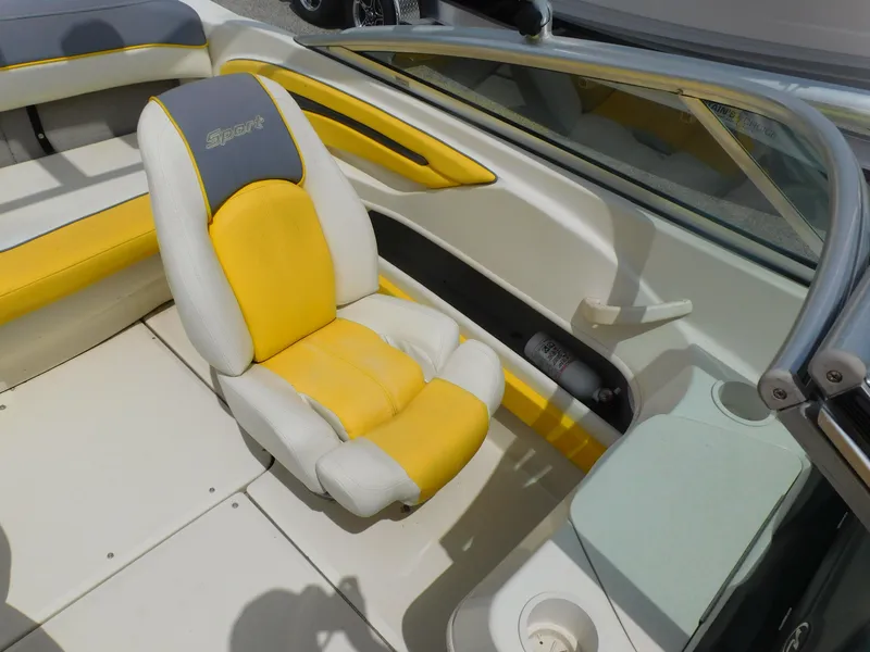 Slide: The Image of 2006 Sea Ray 205 Sport boat interior with yellow and white seating. - 6