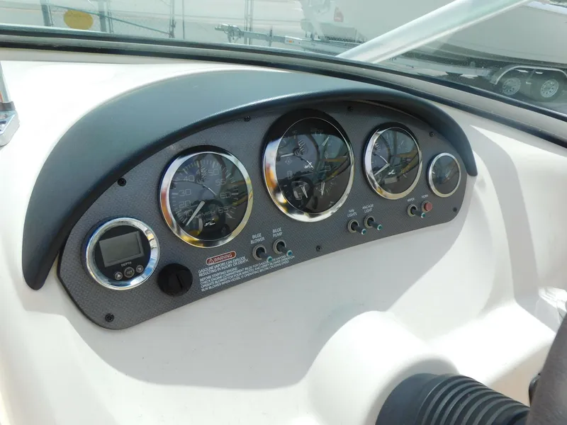 Slide: The Image of Dashboard of a 2006 Sea Ray 205 Sport boat with gauges and controls. - 8