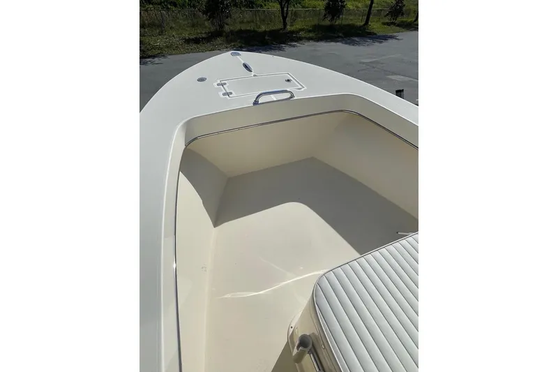 Slide: The Image of 2026 Jones Brothers 20 Cape Fisherman boat under a partly cloudy sky. - 11