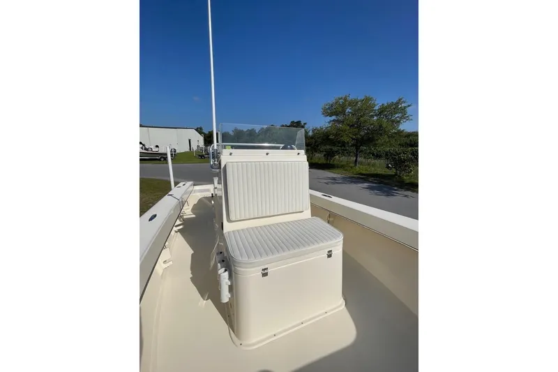 Slide: The Image of 2026 Jones Brothers 20 Cape Fisherman boat, sleek design under clear blue sky. - 14