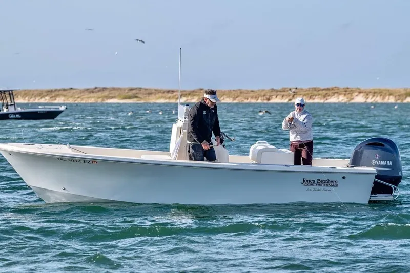 Slide: The Image of 2026 Jones Brothers 20 Cape Fisherman boat on open water with Yamaha engine. - 3