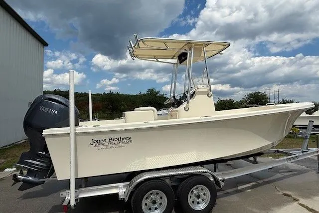 Slide: The Image of 2026 Jones Brothers 20 Cape Fisherman boat on water with two people fishing. - 4