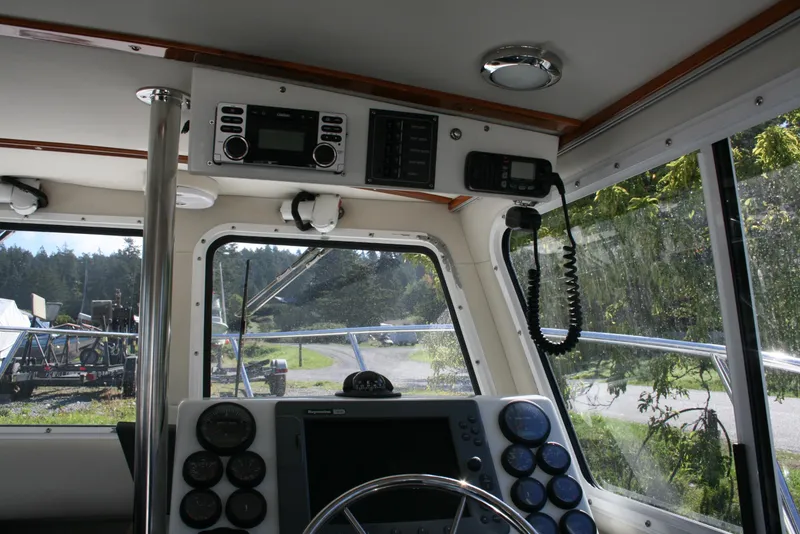 Slide: The Image of Interior view of a 2005 Ocean Sport Roamer 30' #9 boat cockpit with navigation equipment. - 4