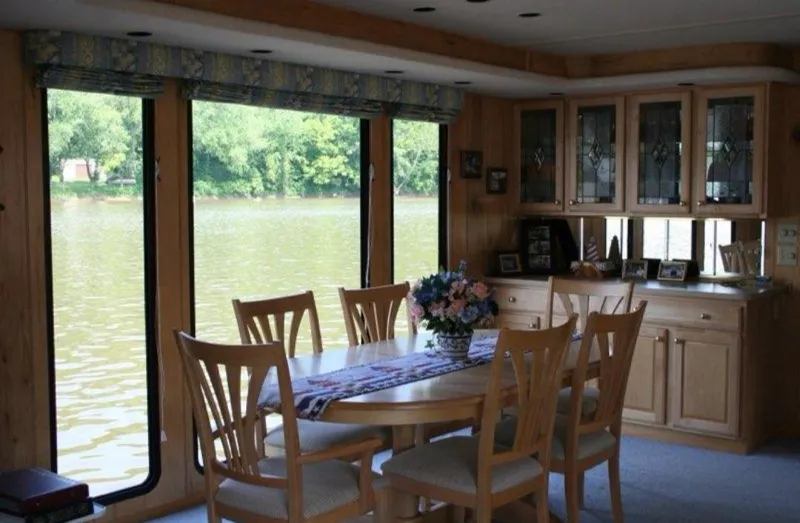 Slide: The Image of Interior of 1999 Sumerset 16x78 houseboat with dining area and river view. - 11