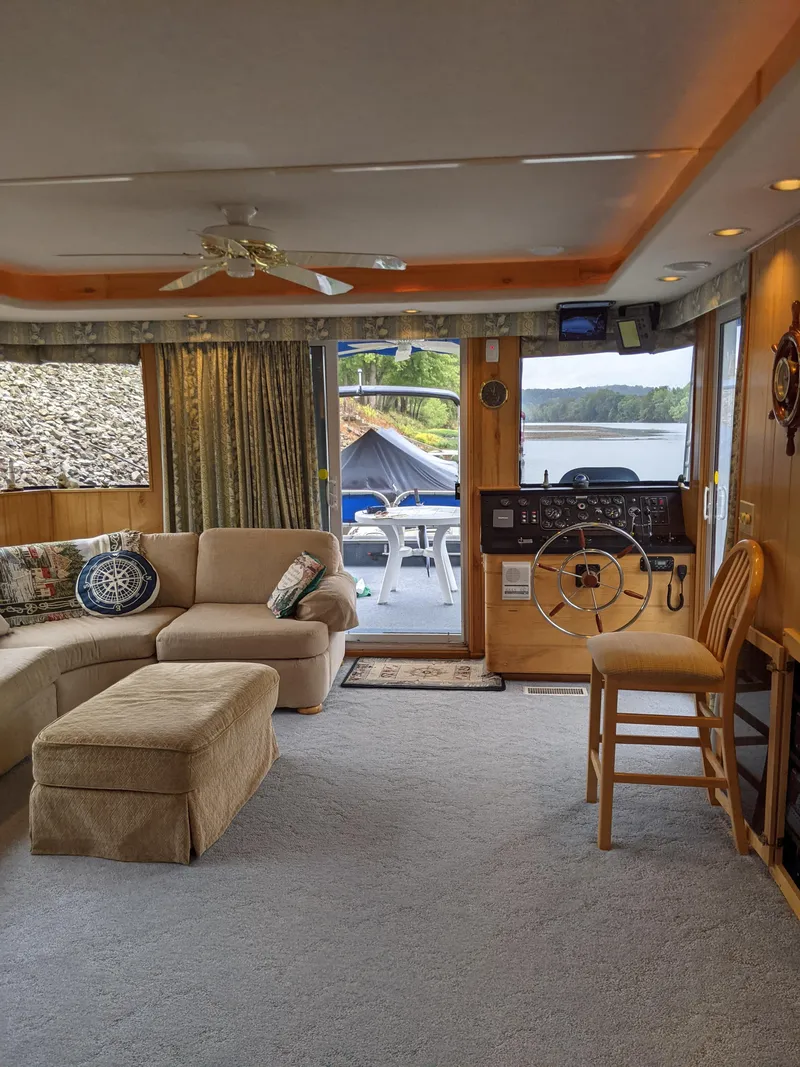 Slide: The Image of Cozy interior of a 1999 Sumerset 16x78 houseboat with lake view. - 12