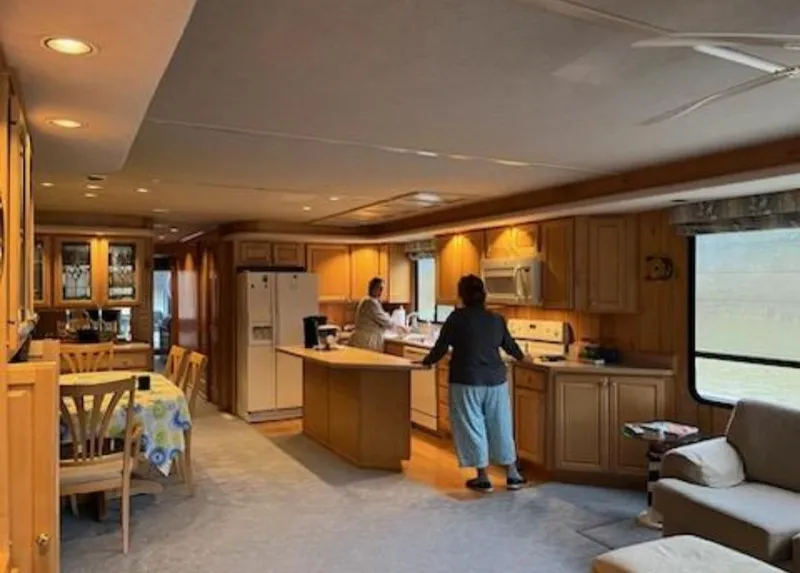 Slide: The Image of Interior of a 1999 Sumerset 16x78 houseboat with kitchen and dining area. - 19