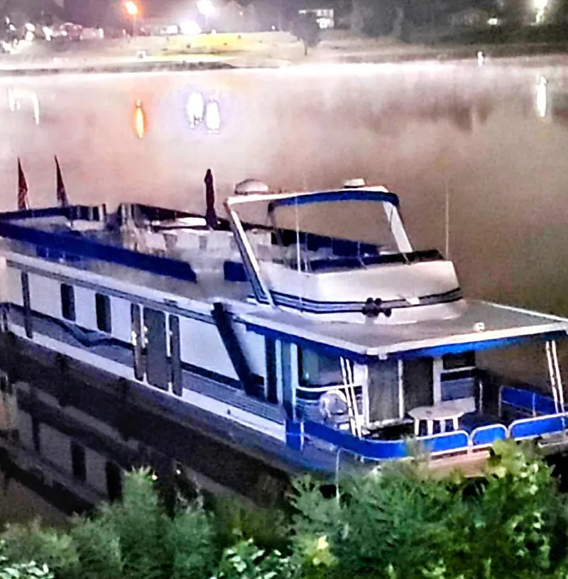 Slide: The Image of 1999 Sumerset 16x78 houseboat on a calm, misty lake at night. - 3