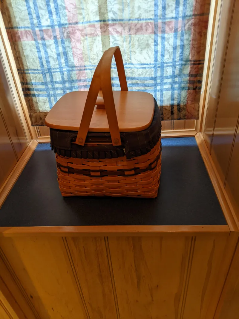 Slide: The Image of Woven basket with wooden lid and handle on a shelf, Sumerset 16x78, 1999 model. - 31