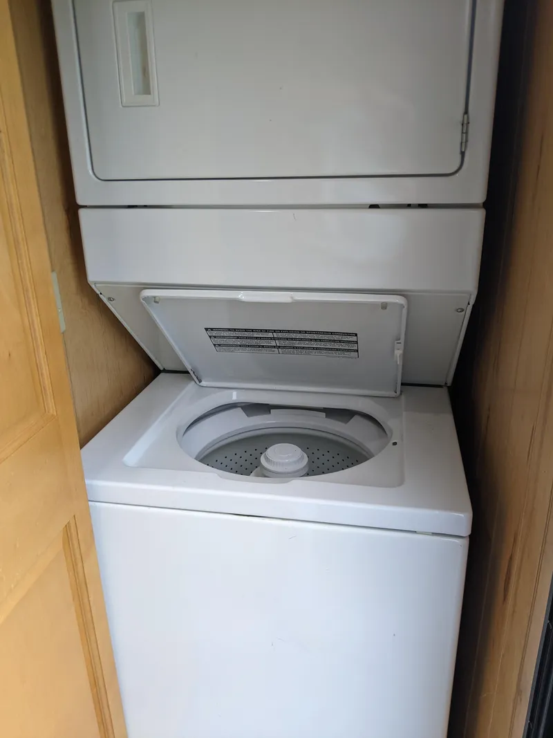 Slide: The Image of Stacked washer and dryer in 1999 Sumerset 16x78 houseboat. - 44