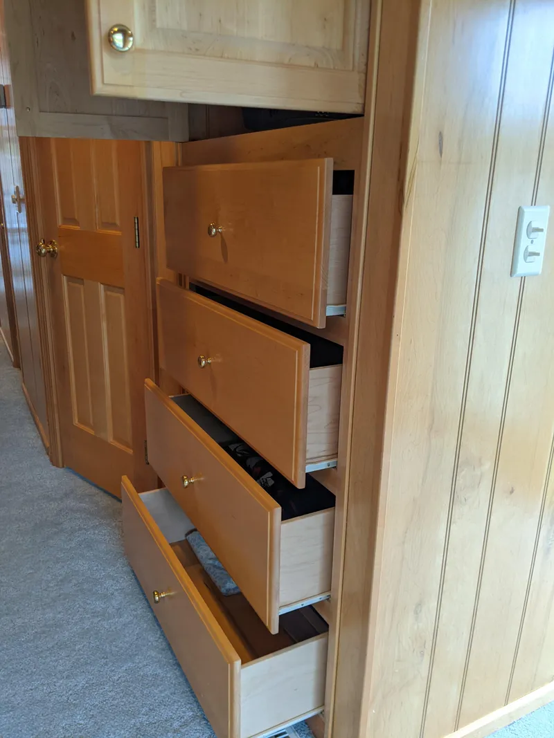 Slide: The Image of Wooden drawers in a Sumerset 16x78 houseboat, 1999 model, with paneled walls. - 46