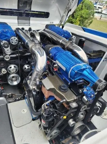 Slide: The Image of Engine compartment of a 2009 Cigarette 46' Rider XP boat, featuring high-performance components. - 10