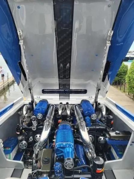 Slide: The Image of 2009 Cigarette 46' Rider XP boat engine compartment with blue accents and open hatch. - 8