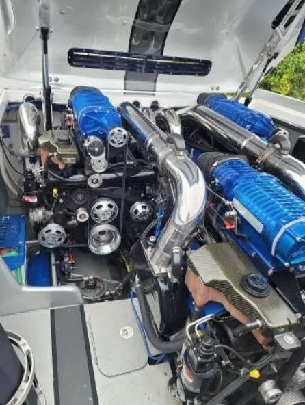 Slide: The Image of 2009 Cigarette 46' Rider XP engine compartment with blue and chrome components. - 9