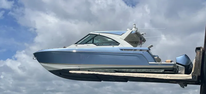 The Image of 2019 Formula 400 SSC boat lifted against a cloudy sky. - 0