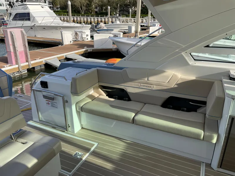 Slide: The Image of 2019 Formula 400 SSC yacht interior with beige seating at marina. - 10