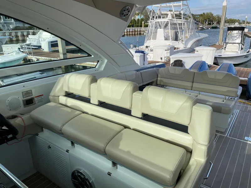 Slide: The Image of 2019 Formula 400 SSC boat interior with beige seating, docked at marina. - 18