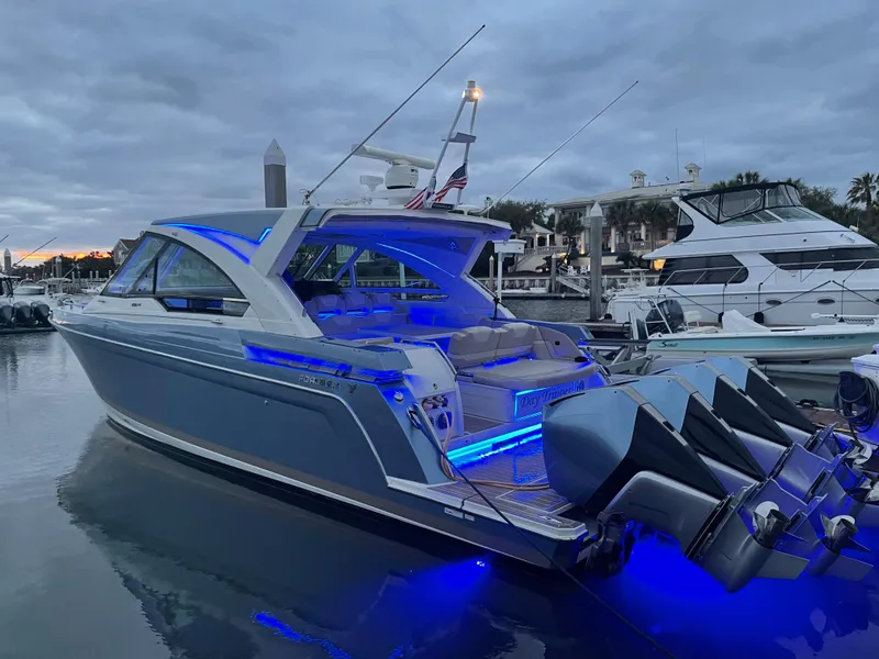 Slide: The Image of 2019 Formula 400 SSC yacht with blue LED lights docked at marina. - 19