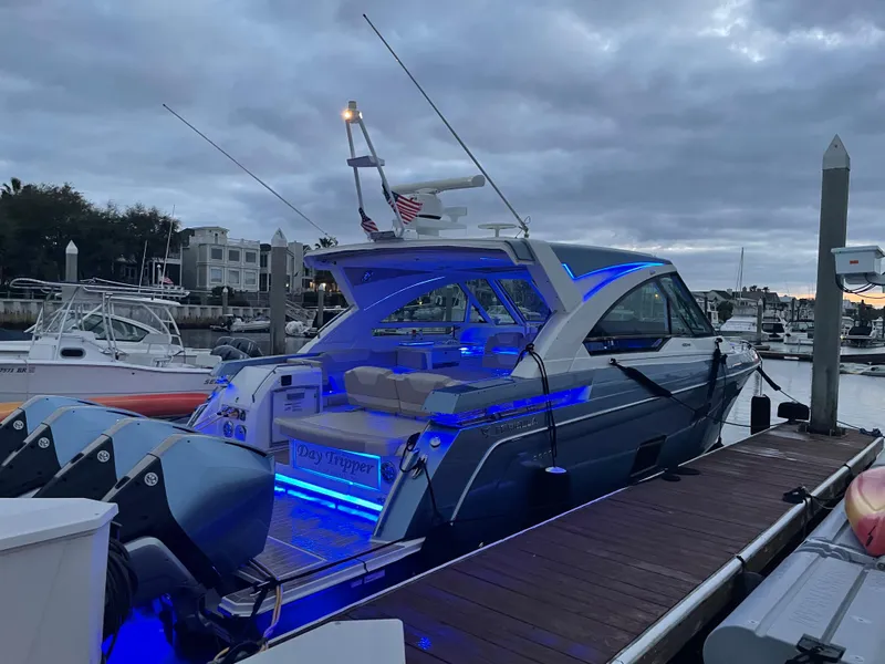 Slide: The Image of 2019 Formula 400 SSC boat docked with blue LED lights at dusk. - 20