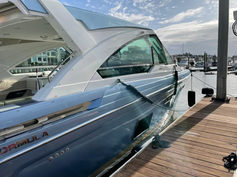 Slide: The Image of 2019 Formula 400 SSC yacht docked at marina under cloudy sky. - 4