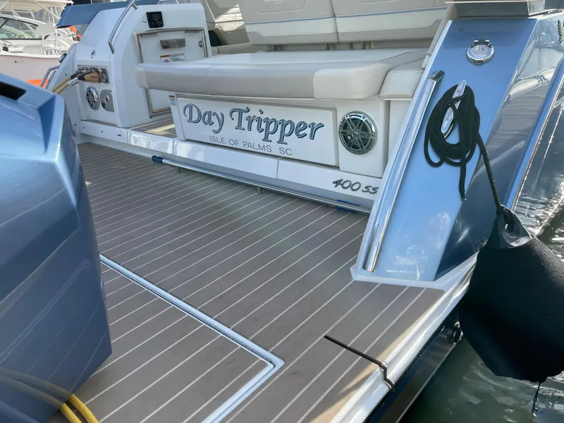 Slide: The Image of 2019 Formula 400 SSC yacht, "Day Tripper," docked with teak deck and seating area. - 5