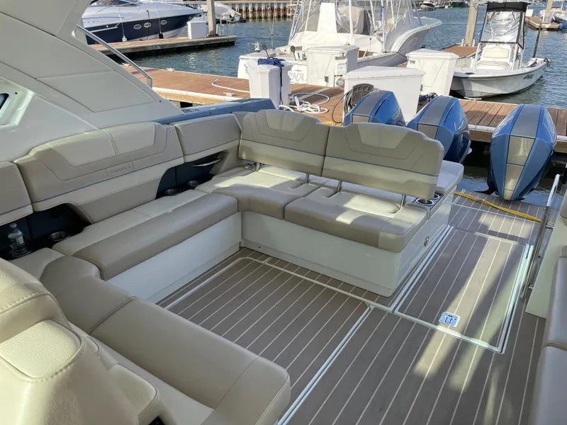 Slide: The Image of Luxurious seating area on a 2019 Formula 400 SSC yacht at a marina. - 9