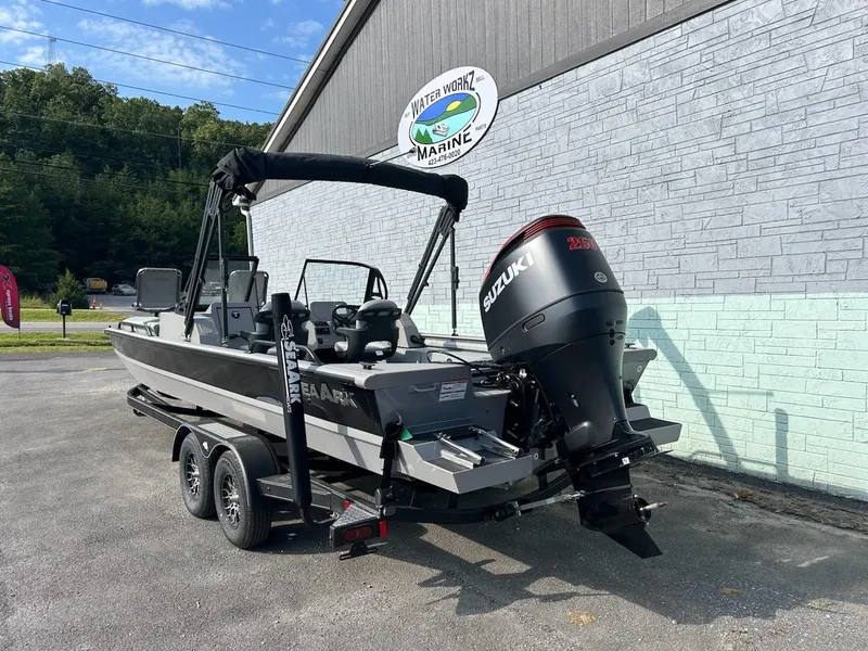 Slide: The Image of 2025 SeaArk EasyCat boat with Suzuki outboard motor on trailer at Water Work Marine. - 2