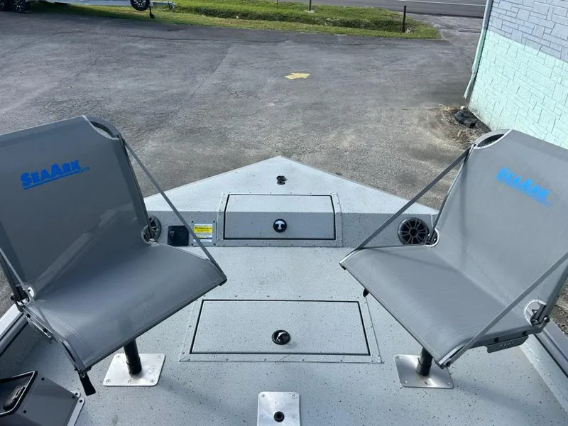 Slide: The Image of 2025 SeaArk EasyCat boat with two gray seats on deck. - 3